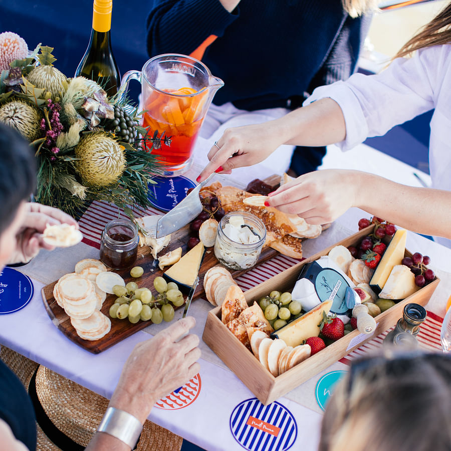 Group of Friends Enjoying Cheese Board at a Gathering